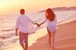 young couple  on beach have fun photo