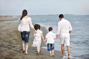 happy young family have fun on beach photo