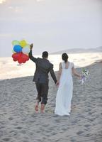 romantic beach wedding at sunset photo