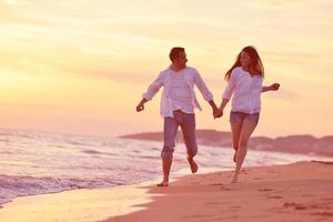 young couple  on beach have fun photo