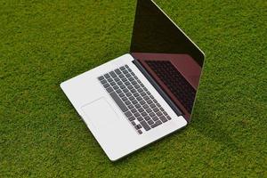 laptop computer  on grass photo