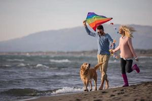 happy couple enjoying time together at beach photo