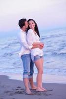 young couple  on beach have fun photo