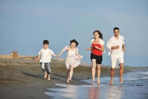 happy young family have fun on beach photo