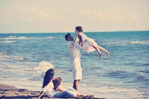 happy young  family have fun on beach photo