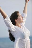 young woman enjoy on beach photo