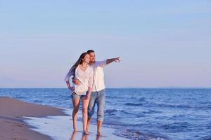 young couple  on beach have fun photo