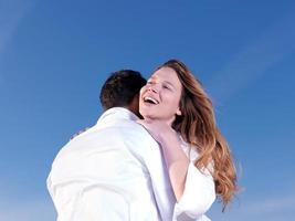 young couple  on beach have fun photo