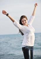 young woman enjoy on beach photo