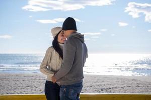 Couple chating and having fun at beach bar photo