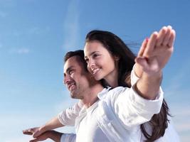 young couple  on beach have fun photo