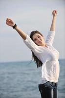 young woman enjoy on beach photo