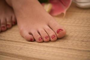 female feet at spa salon photo