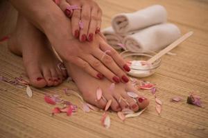 female feet and hands at spa salon photo