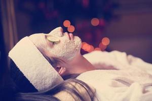 woman in spa  with cosmetic mask photo