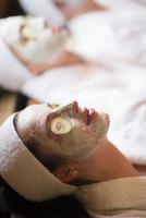 woman in spa  with cosmetic mask photo