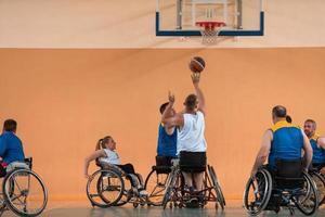 a photo of basketball teams with disabilities with the selector in the big hall before the start of the basketball game