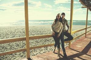 Couple chating and having fun at beach bar photo