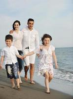 happy young family have fun on beach photo