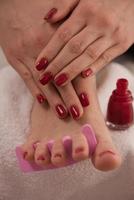 female feet and hands at spa salon photo