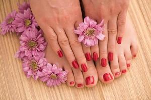 female feet and hands at spa salon photo