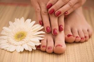 female feet and hands at spa salon photo