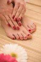 female feet and hands at spa salon photo