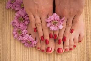 female feet and hands at spa salon photo