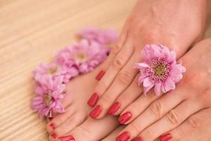 female feet and hands at spa salon photo