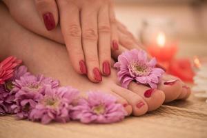 female feet and hands at spa salon photo