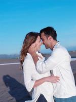 young couple  on beach have fun photo