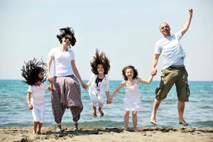 happy young family have fun on beach photo