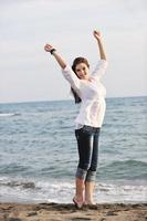 young woman enjoy on beach photo