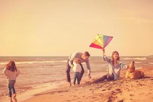 happy young family enjoying vecation during autumn day photo