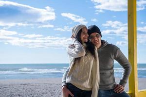 Couple chating and having fun at beach bar photo