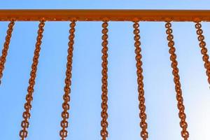 yellow railing with chains photo