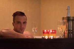 man relaxing in the jacuzzi photo