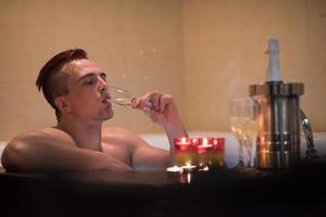 man relaxing in the jacuzzi photo