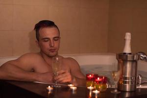 man relaxing in the jacuzzi photo