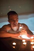 man relaxing in the jacuzzi photo