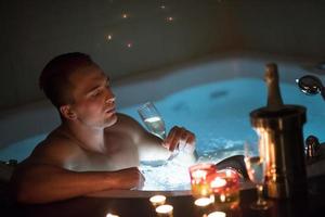 man relaxing in the jacuzzi photo