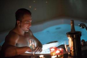 man relaxing in the jacuzzi photo