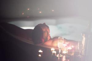 man relaxing in the jacuzzi photo