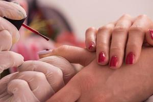 Woman hands receiving a manicure photo