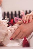 Woman hands receiving a manicure photo