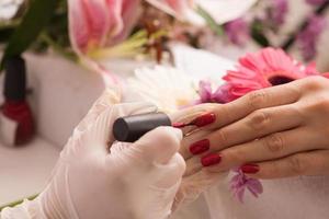 Woman hands receiving a manicure photo