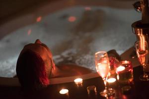 man relaxing in the jacuzzi photo