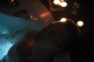 man relaxing in the jacuzzi photo