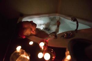 man relaxing in the jacuzzi photo