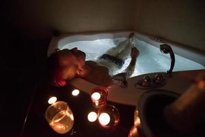 man relaxing in the jacuzzi photo